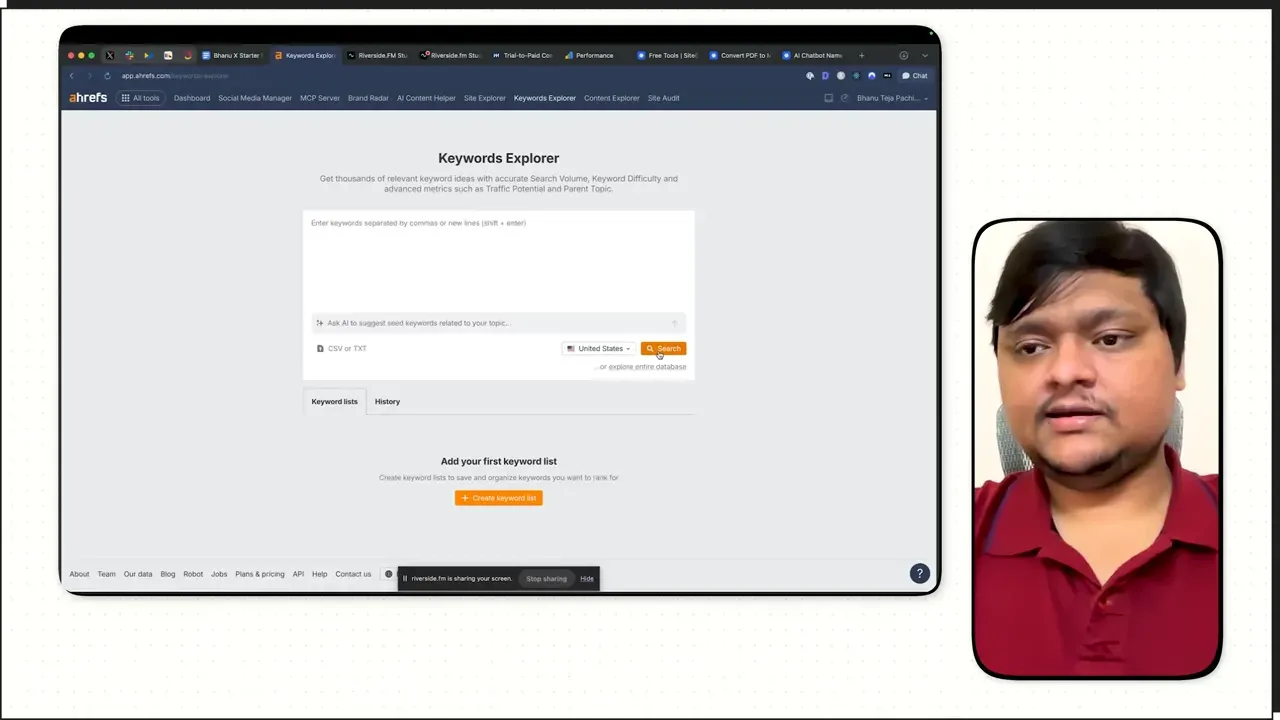 Ahrefs Keywords Explorer screen with a small inset video of the interview subject